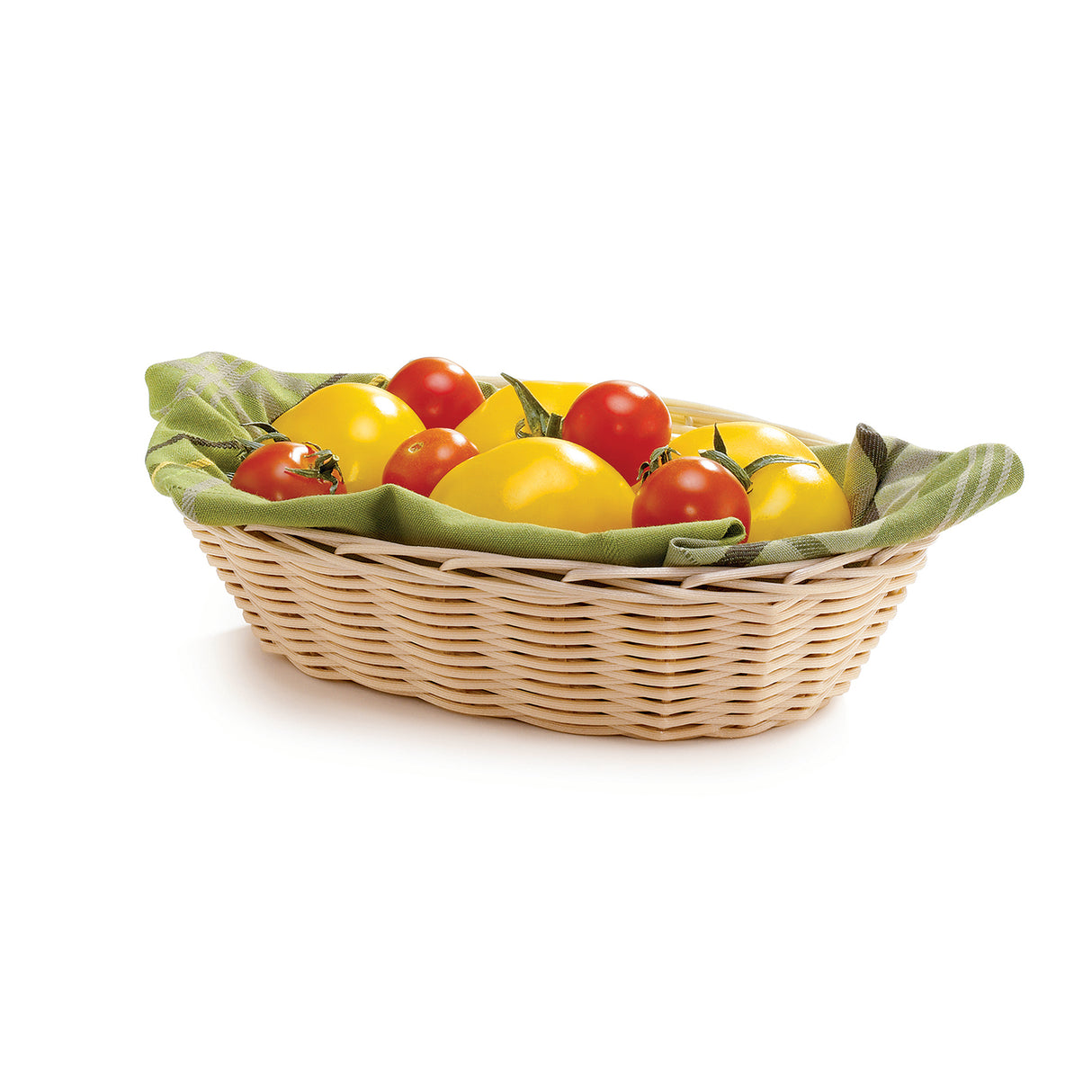A light hand-woven basket lined with a green cloth holds several fresh tomatoes, including large yellow ones and smaller red ones, on a white background.