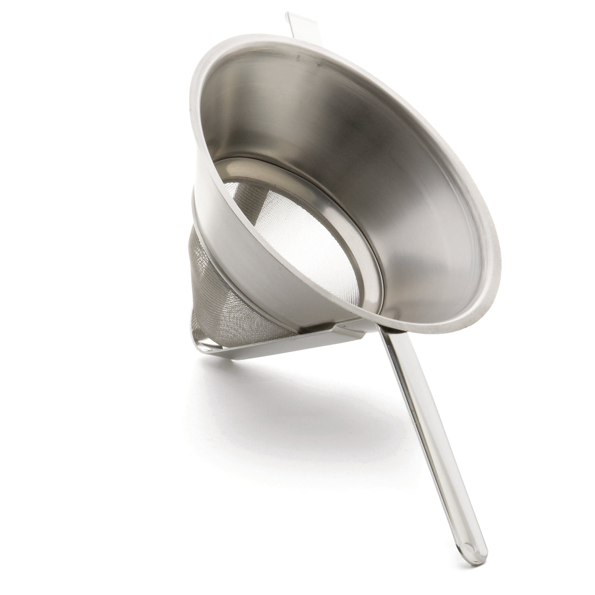 A stainless steel bouillon strainer with a conical shape rests on its side. Featuring fine mesh, a long handle, and a support hook for stability over bowls or pots, it's ideal for sifting or straining liquids and solids.