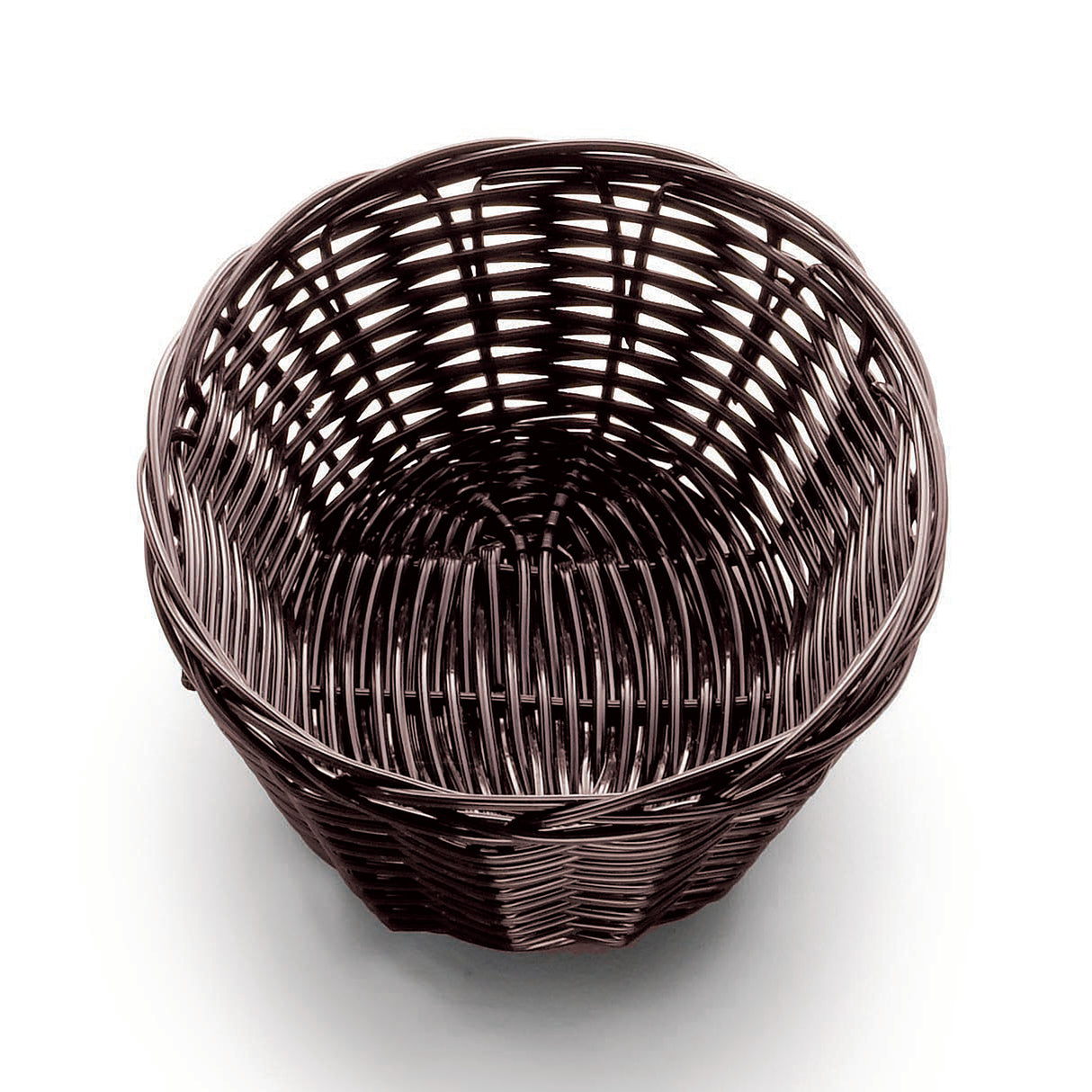 A round, empty, dark brown hand-woven basket sits on a white surface. The tightly woven pattern of polypropylene cord features visible vertical and horizontal strands, creating an open, airy texture. The view from above shows the circular shape inside.