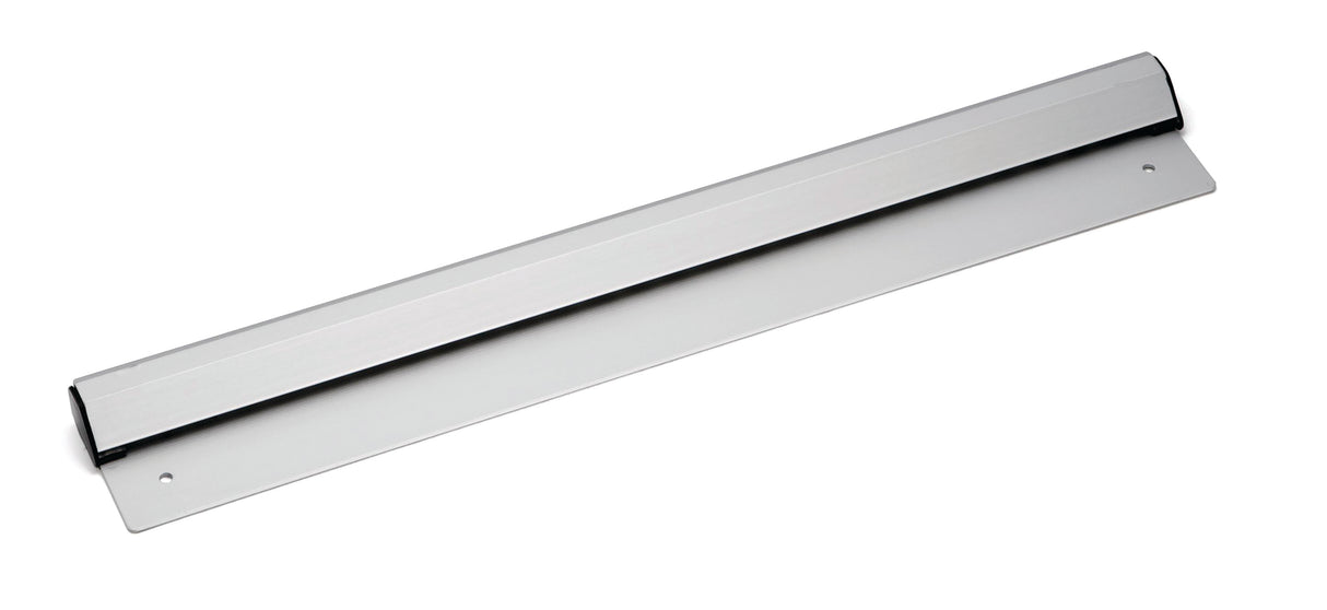 A silver aluminum door kick plate with two screw holes on each end is shown against a white background. The plate has a smooth, angled surface and is designed to protect the lower part of a door from scuffs or damage.