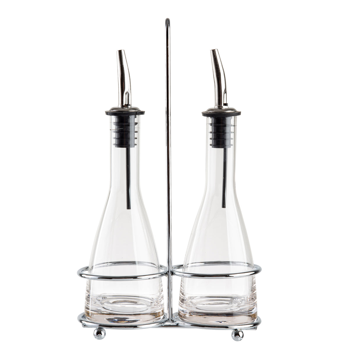 Two glass bottles with stainless steel pourers sit side by side in a silver metal holder with a central handle. This elegant oil and vinegar set features wide bases, narrow necks, and round feet, all displayed against a white background.