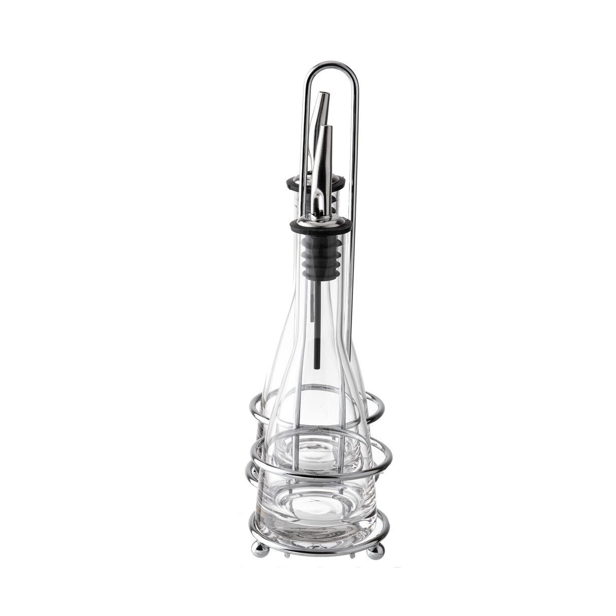 A clear glass oil dispenser bottle with a stainless steel pourer sits in a circular chrome wire stand with a handle. Sleek and modern, this piece is ideal for kitchen or table use and makes a stylish addition to any oil and vinegar set. Background is plain white.