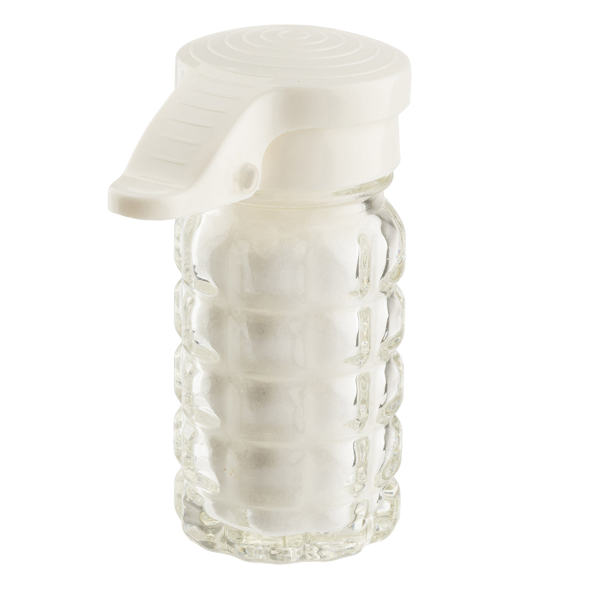 A clear glass salt shaker shaped like a hand grenade, filled with white salt, features a moisture proof white plastic lid resembling a grenade’s safety lever. The salt/pepper shaker is isolated on a white background.