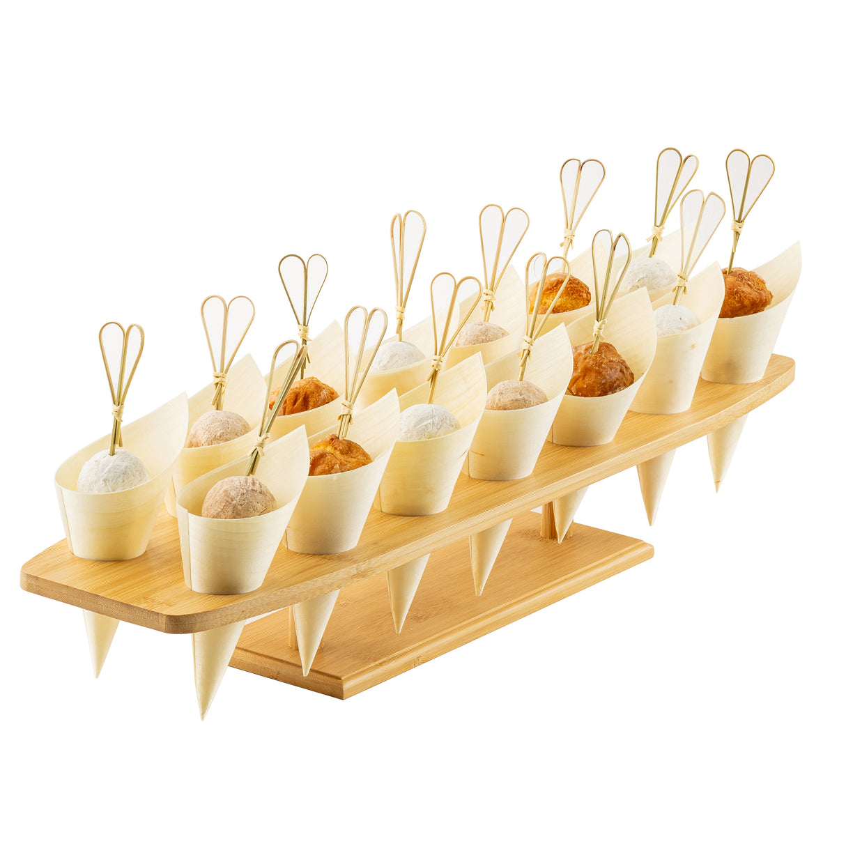 A wooden serving tray features a TableCraft cone holder with rows of small, natural bamboo cups, each topped with a decorative looped pick. The cones are filled with bite-sized balls in white, beige, and golden brown against a plain background.