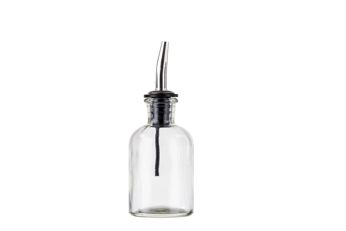 A clear, empty glass bottle with a narrow neck and a stainless steel pourer. The spout features a black rubber stopper securing it to the oil & vinegar bottle. The plain white background keeps the bottle centered in the image.