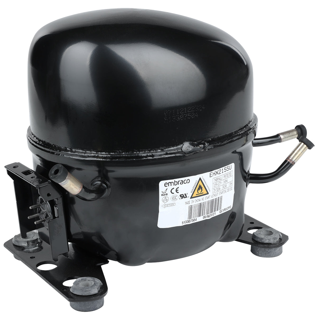 A black, cylindrical Embraco compressor for Empura Refrigeration, with a domed top and four rubber feet. Two metal pipes protrude from the sides, and a white label with technical details from Empura Parts is attached to the front.