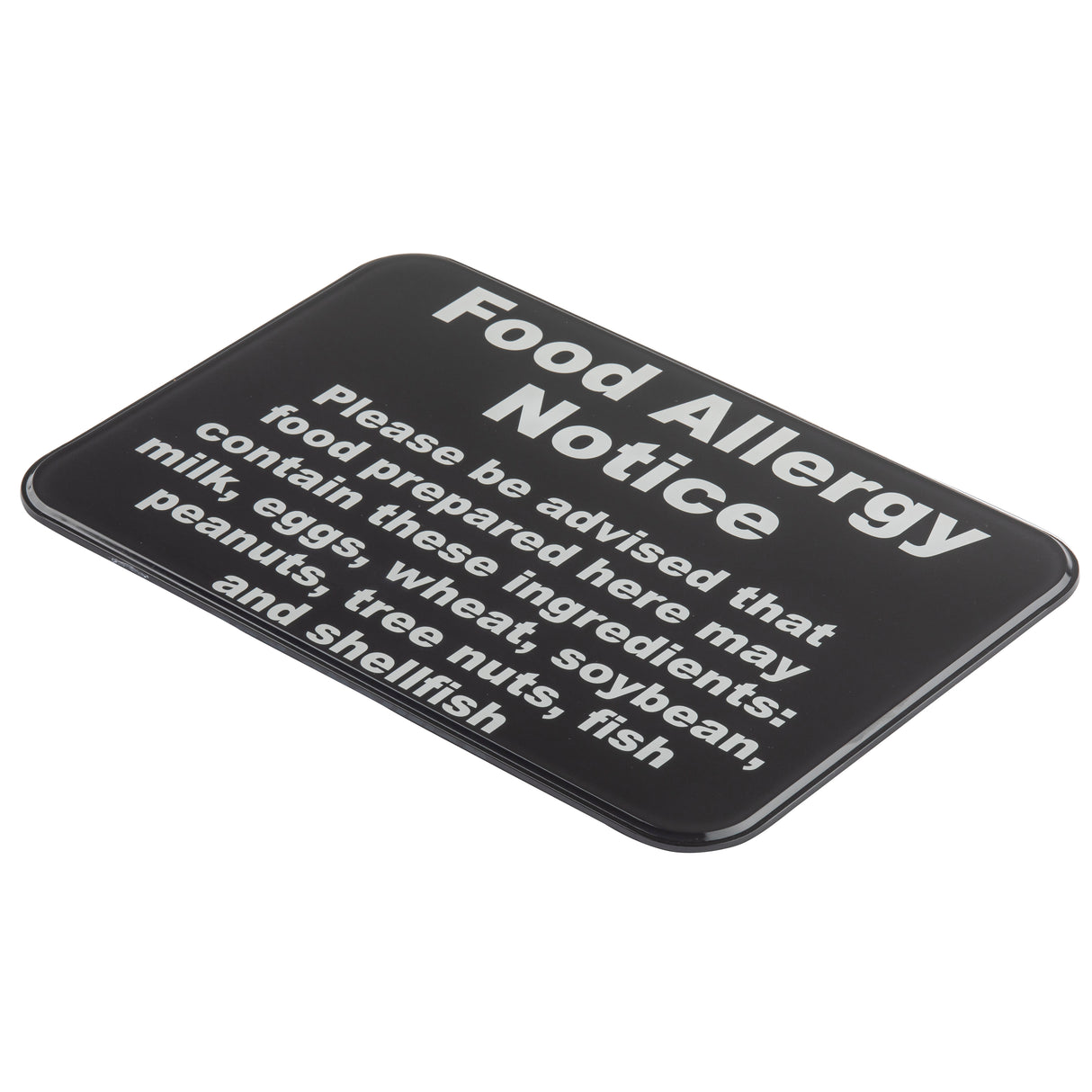 A wall mounted rectangular black warning sign with bold white text reads: “Food Allergy Notice. Please be advised that food prepared here may contain these ingredients: milk, eggs, wheat, soybeans, peanuts, tree nuts, fish, and shellfish.”.