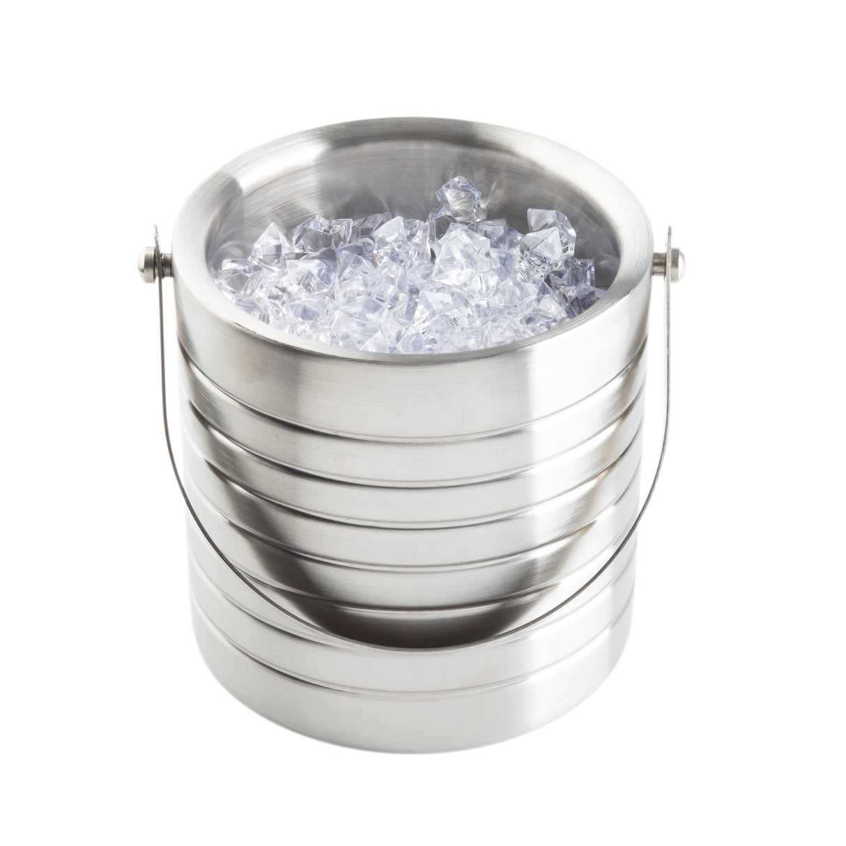 The TableCraft stainless steel ice bucket features a shiny, ribbed exterior and a curved metal handle. Filled with clear ice cubes and set against a plain white background, it perfectly highlights the bucket’s elegant design.