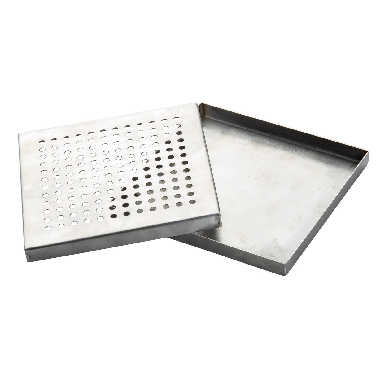 Two rectangular TableCraft stainless steel trays are shown. One solid drip tray sits beneath a perforated tray with evenly spaced round holes, the two trays slightly overlapping.