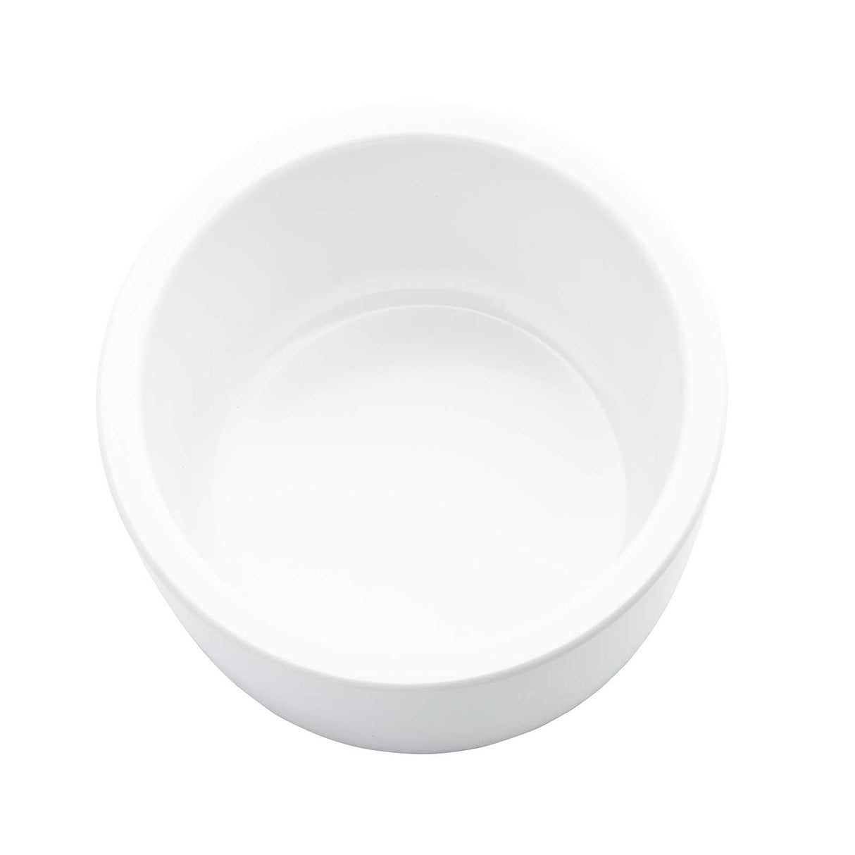 A plain, round, white 6 oz ramekin bowl is shown from above on a white background. The bowl is empty and casts a faint shadow inside, highlighting its smooth and glossy surface.