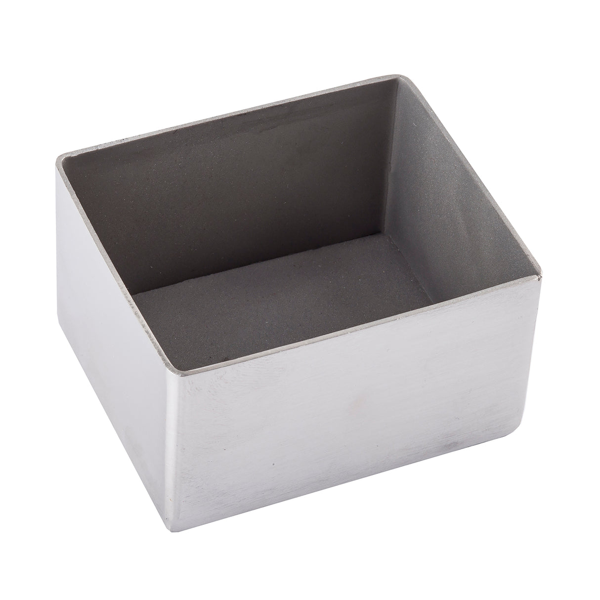 A rectangular, shallow stainless steel sugar packet holder with smooth sides and a flat base, shown isolated on a white background from a slightly elevated angle. The interior appears matte and darker than the shiny, dishwasher safe exterior.