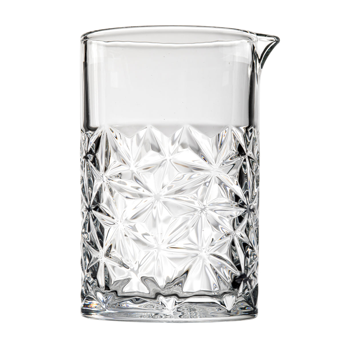 A clear TableCraft mixing glass from the Waverly Collection features geometric, starburst-patterned embossing on the lower half, a smooth upper section, and a small pouring spout. The pitcher stands upright against a white background.