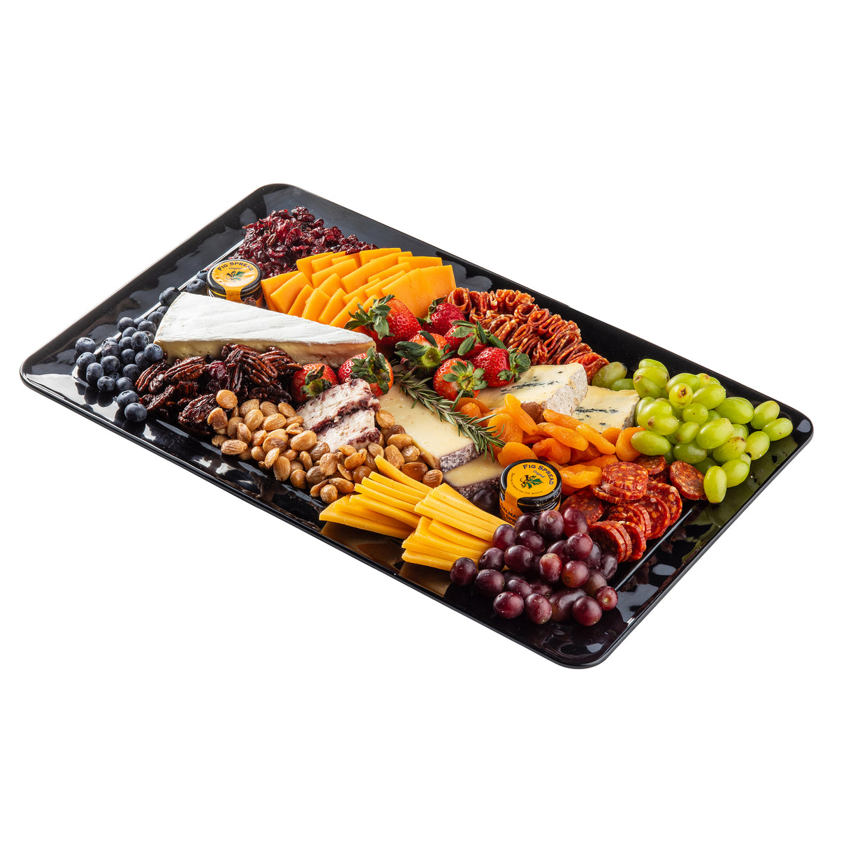 A rectangular melamine platter filled with assorted cheeses, salami, crackers, pecans, cashews, grapes, dried apricots, strawberries, blueberries, and honey containers—each arranged in neat, colorful sections on a white background.
