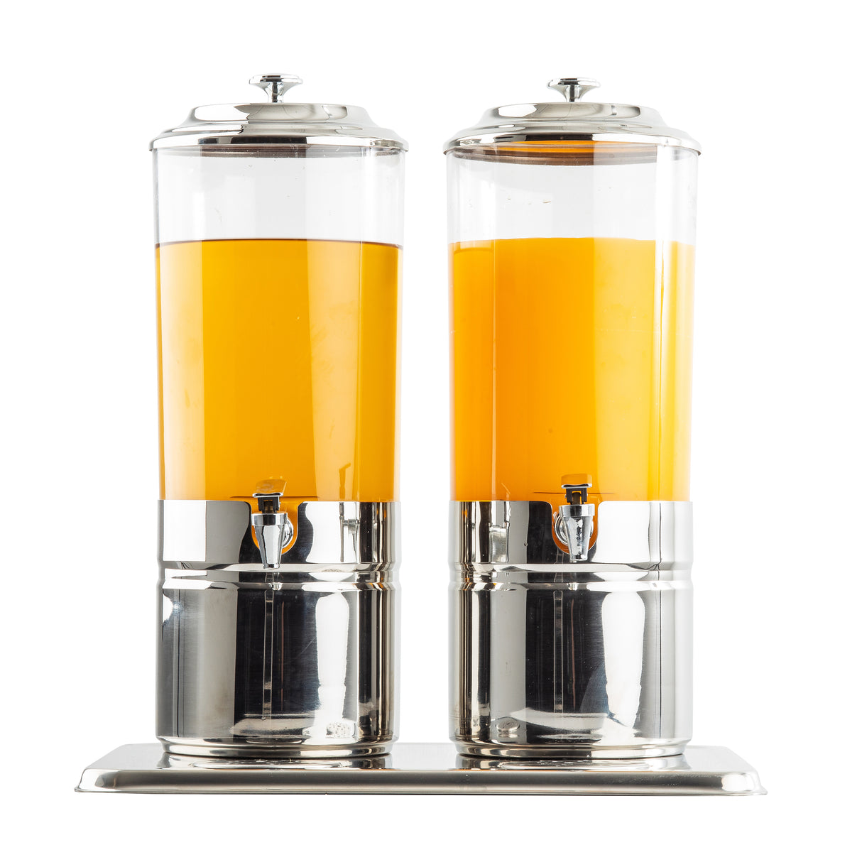 Two tall, clear polycarbonate beverage dispensers with shiny silver bases and lids stand side by side on a metal tray. Each 4-gallon dispenser is filled with orange liquid at slightly different levels and features a small spigot for pouring.