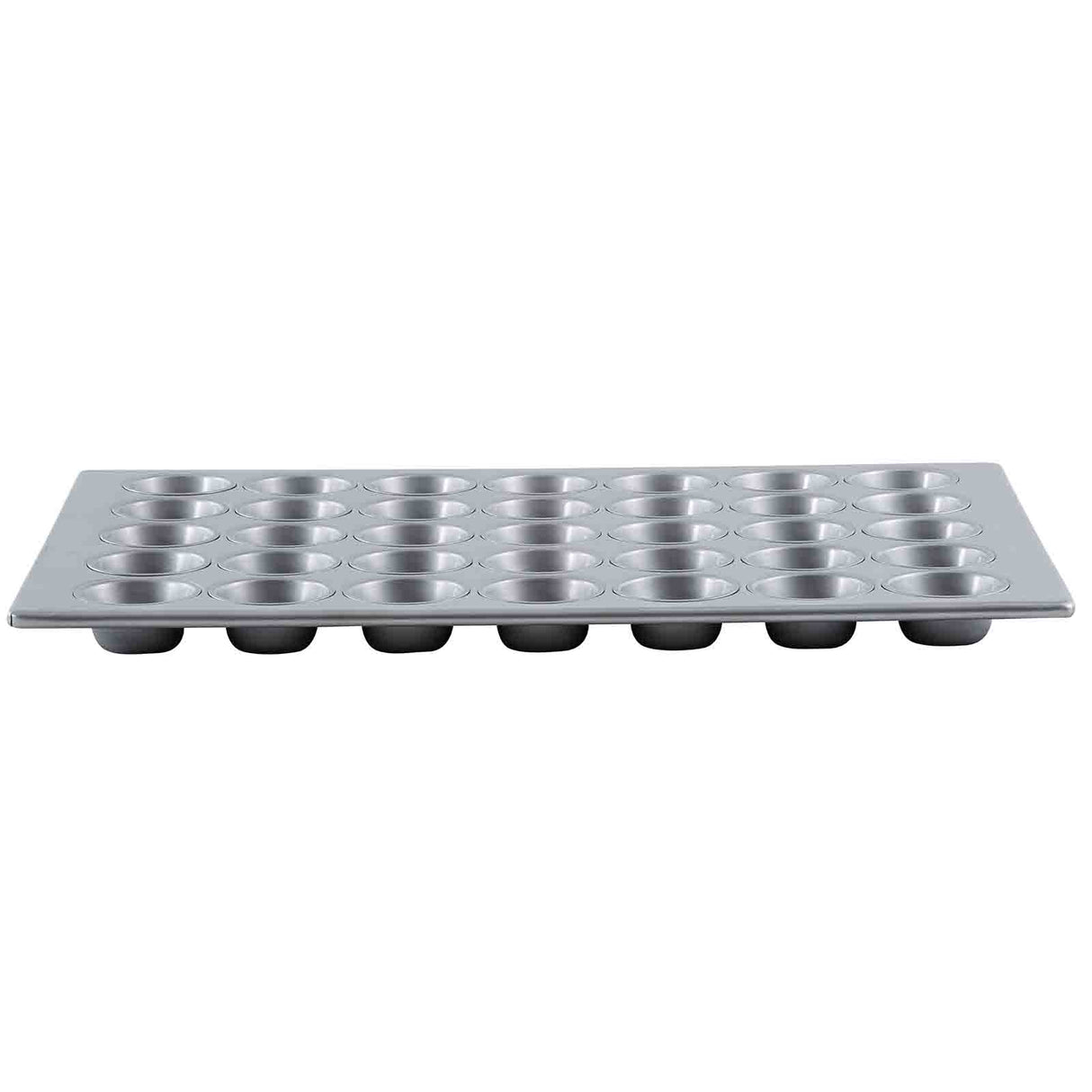 A silver, rectangular non-stick muffin pan with 24 evenly spaced, round cup molds arranged in a 4x6 grid; the pan is viewed from the side, showing the depth of each cup.
