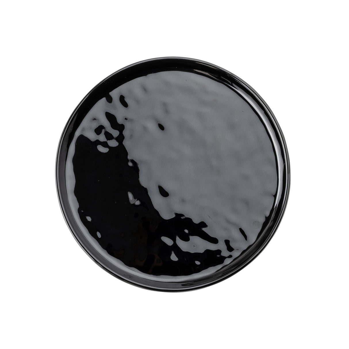A round, glossy black TableCraft serving plate is shown from above against a white background. The plate has a smooth, reflective melamine surface with subtle irregularities and a slightly raised rim.