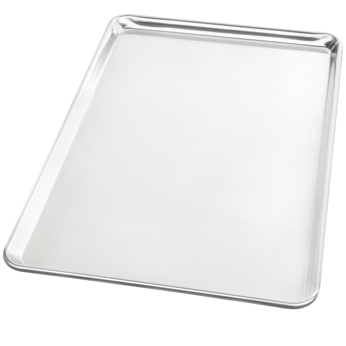 A large, shiny, full size bun sheet pan made from heavy duty aluminum with slightly raised, rounded edges is shown at an angle on a plain white background. The baking sheet has a smooth surface and appears clean and empty.