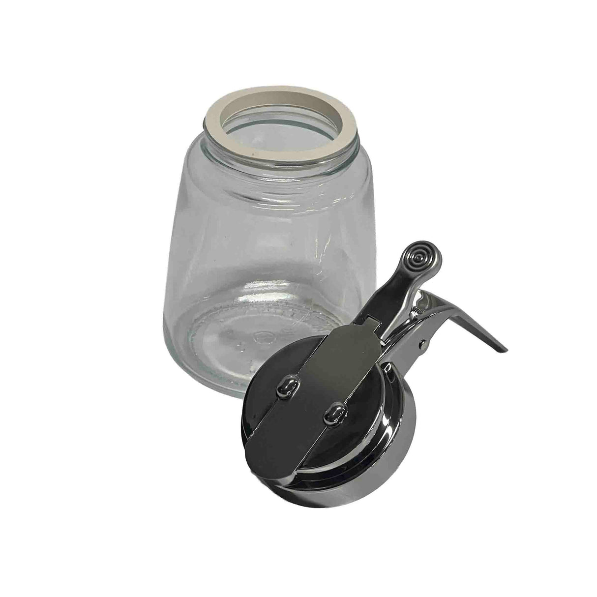 A clear, empty Modern Glass Dispenser jar with a wide mouth rests on its side next to a detached, chrome plated metal clamp lid with a silicone seal. The background is plain white and the jar is dishwasher safe.