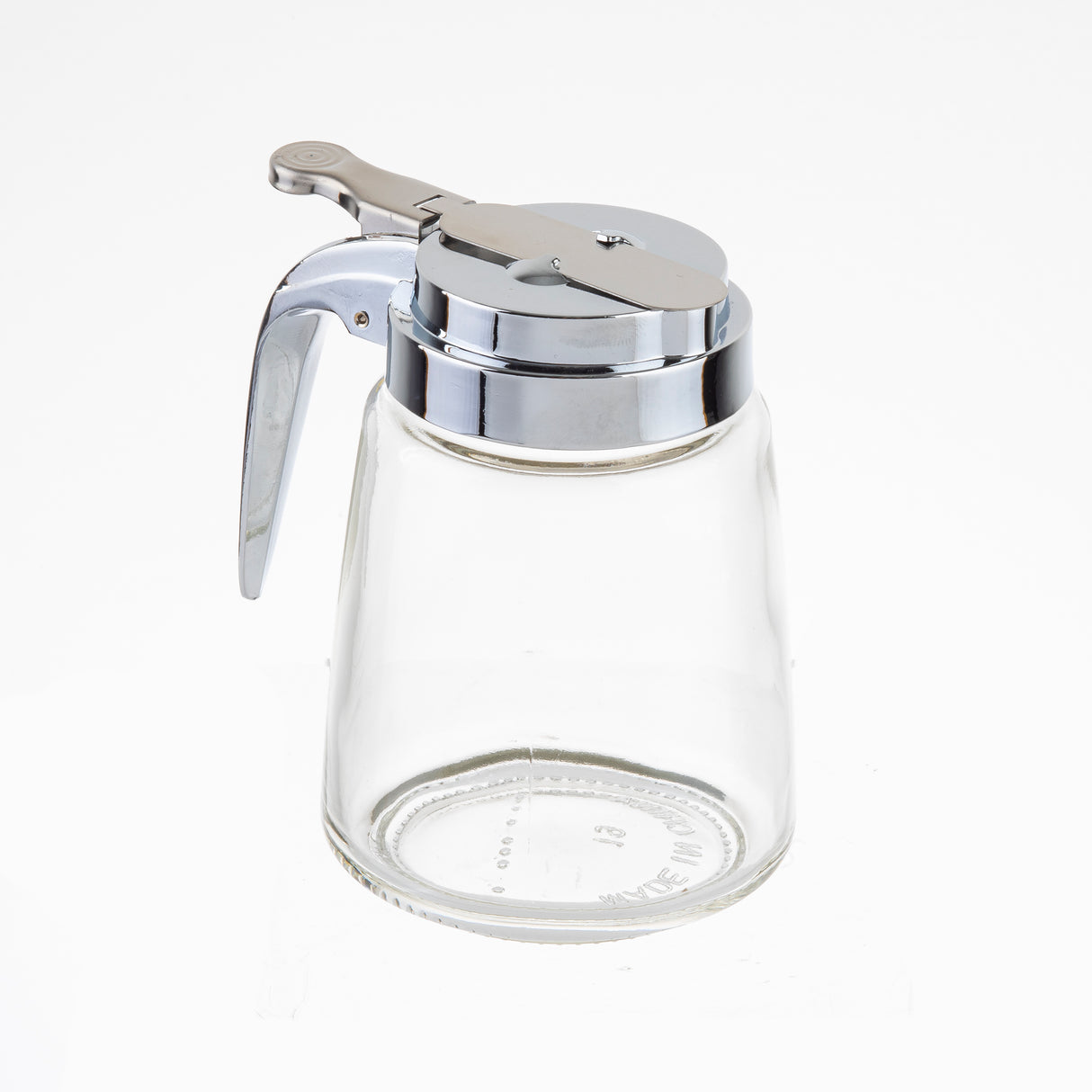 A Modern Glass Dispenser, this 8 oz. clear glass syrup jar features a shiny metal lid, handle, and lever. The lid's small spout and hinged lever allow easy pouring. Dishwasher safe for convenient cleaning, it's photographed on a plain white background.