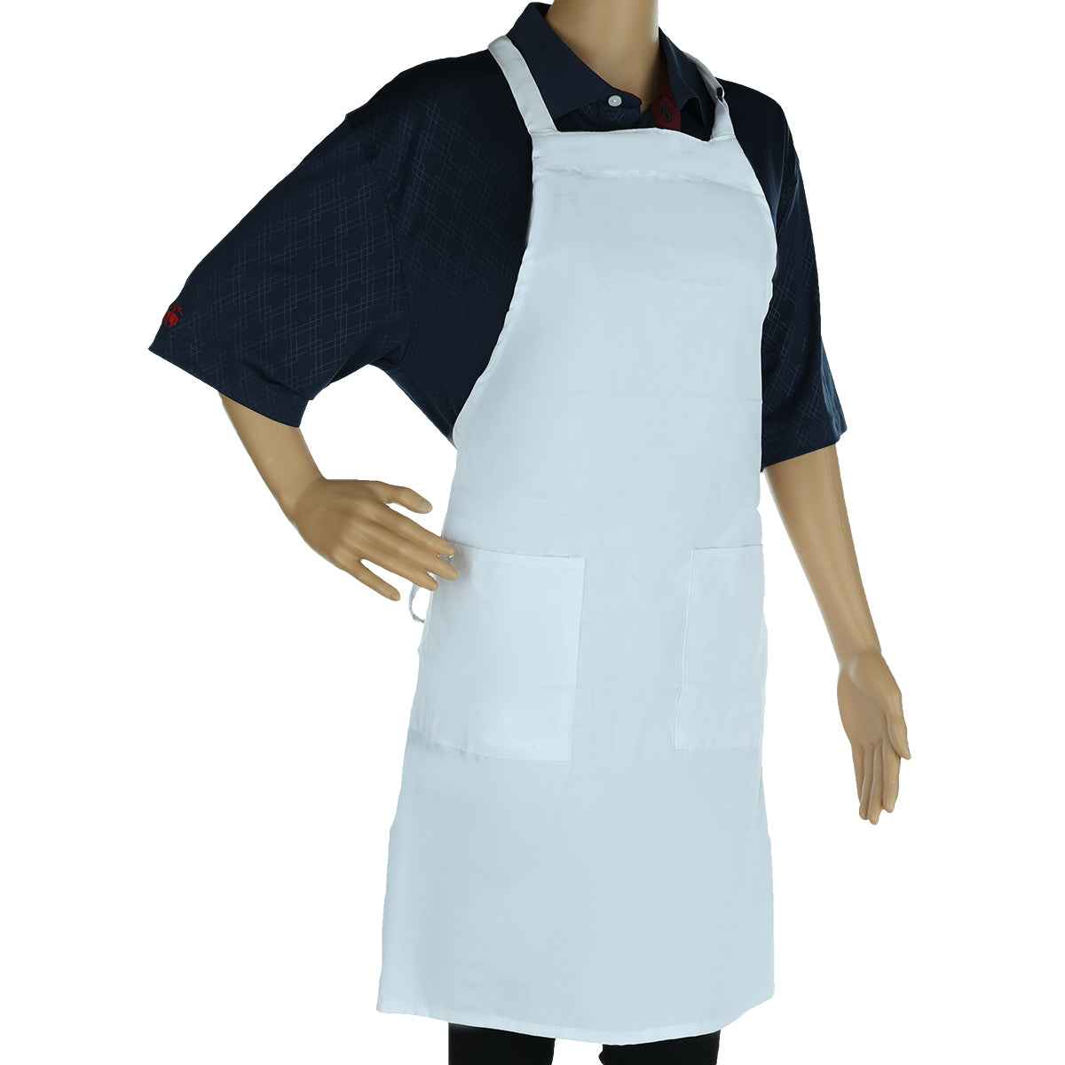 A mannequin wears a dark blue collared shirt and a machine washable, plain white bib apron with two large front pockets. One hand is on its hip while the other rests at its side against a white background.