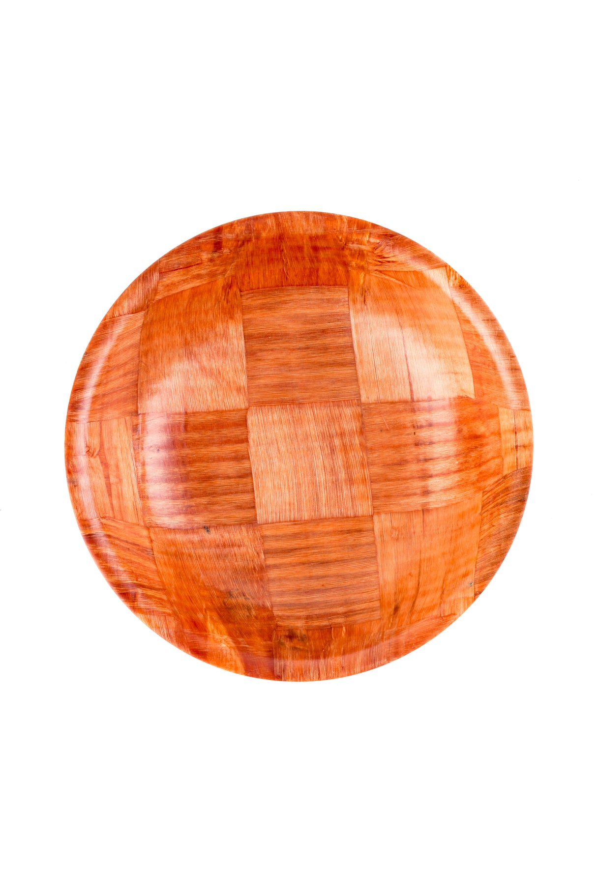 A round wooden plate with a glossy finish, featuring a checkered pattern of alternating wood grain directions in warm mahogany tones. The plate is photographed from above on a plain white background, resembling an artisanal woven wood salad bowl.