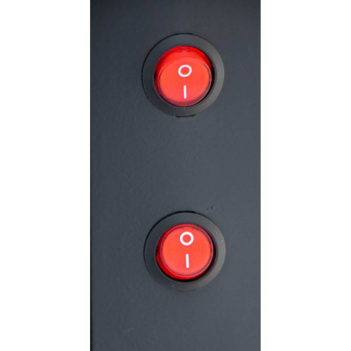 Close-up of two red circular rocker switches on a dark surface, often found on Empura Refrigeration units like a Glass Swing Door Refrigerated Merchandiser. Both switches, marked with “I” and “O,” are aligned vertically and appear to be in the “on” position.