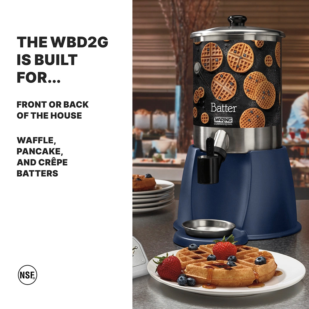 A stainless steel batter dispenser with 2 gallon capacity, decorated with waffle images, sits on a blue base. In front, a plate holds waffles topped with berries and powdered sugar—perfect for waffle, pancake, and crêpe batters.