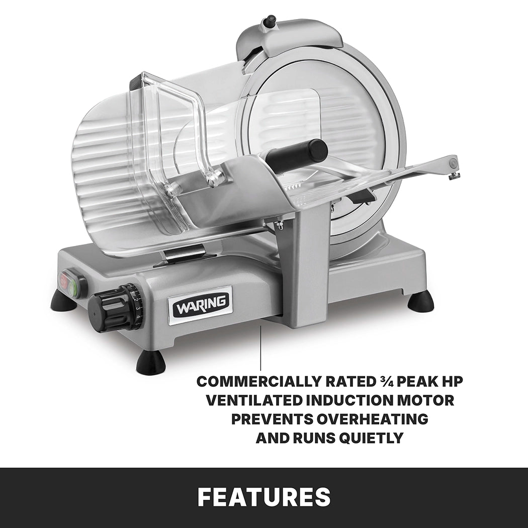 A silver Waring Commercial Food Slicer with a clear safety guard and black handle sits on a white background. Caption notes: Commercially rated ¾ peak HP ventilated induction motor prevents overheating, runs quietly, and offers adjustable slice thickness.