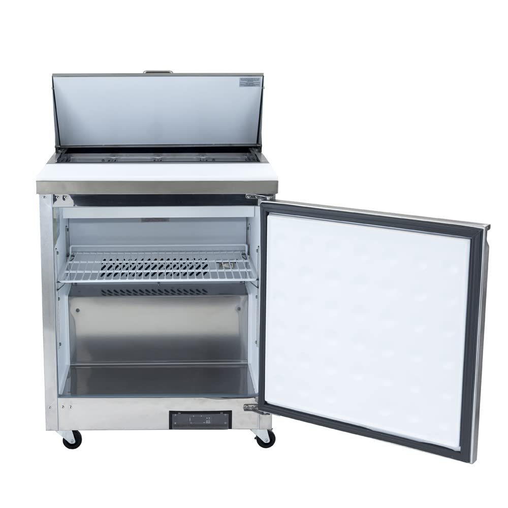 An Empura Refrigeration stainless steel Salad Prep Table is shown with its top lid open and door wide. Inside, there’s a wire shelf and empty compartment. The plain white interior of the front door contrasts with the fridge’s black wheels.