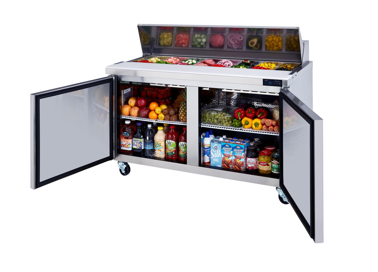 A stainless steel refrigerated prep table with two open doors. The top section displays sliced vegetables, lettuce, cheese, and deli items. The lower shelves of this Blue Air BLPT60-HC are stocked with fruits, bottled drinks, milk, and juices.