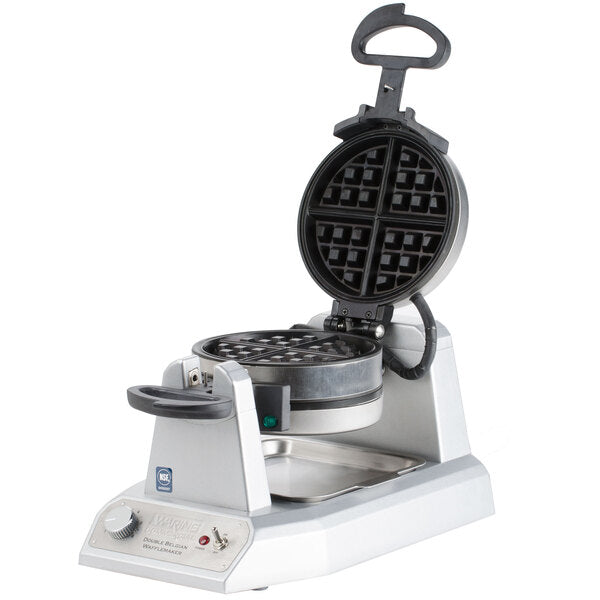 A stainless steel Belgian Waffle Maker with a round, nonstick grid divided into four sections. The appliance is open, showing black waffle plates. A handle is attached to the lid, with control knobs and indicator lights on the front panel.