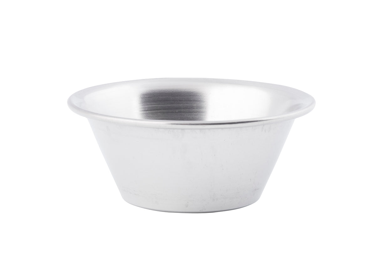 A plain, round, shallow 2 oz stainless steel sauce cup with a smooth, brushed silver finish sits empty on a white background. The bowl features slightly sloped sides and a wide rim, viewed from a slight angle.