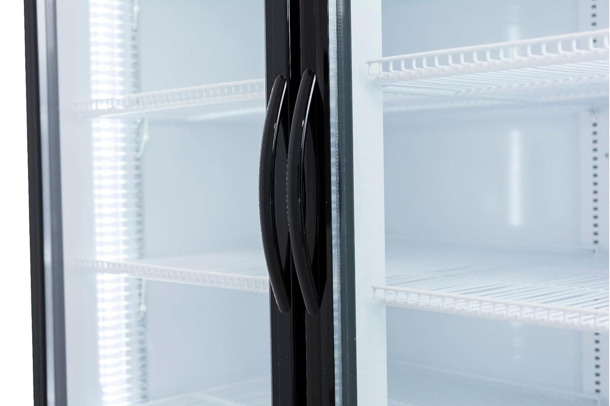 Close-up of an Empura EGM-50B commercial refrigerated merchandiser with two glass doors, black handles, and empty white wire shelves. Bright lighting illuminates the spacious, temperature-controlled display and highlights its modern, sleek design.