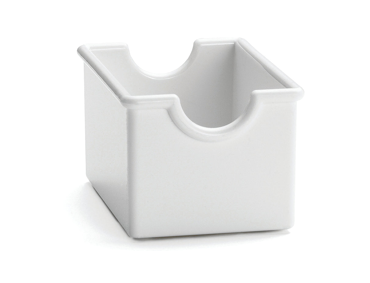 A white, rectangular ceramic sugar packet rack with an open top and two semi-circular notches on opposite sides of the rim. The glossy surface and simple, modern design are complemented by its dishwasher safe convenience.