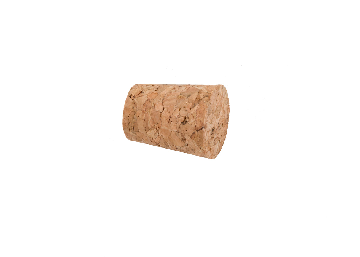 A single cylindrical TableCraft cork stopper lies on its side against a plain white background. The light brown cork, with its slightly rough, mottled texture and irregular patches, is natural and should be hand wash only.