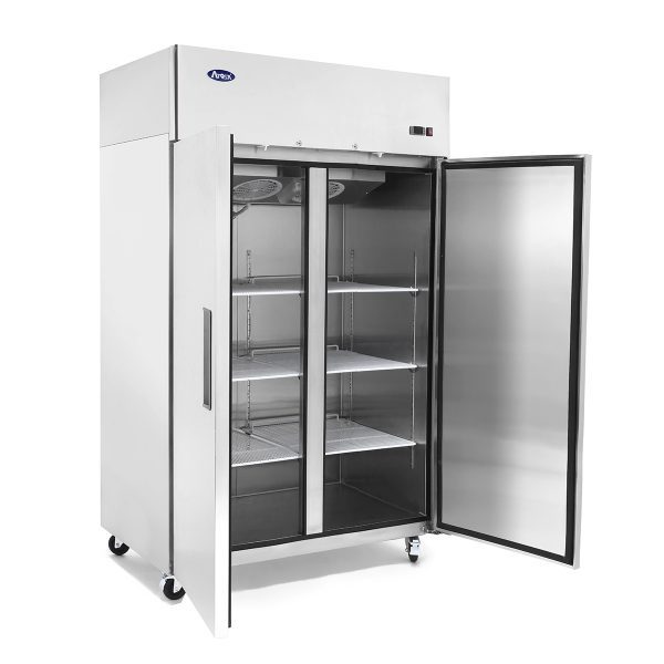 A large, stainless steel reach-in refrigerator with double doors, one door open to reveal empty wire shelves inside. The exterior is shiny and reflective, featuring handles on both doors and small wheels on the bottom for mobility—perfectly suited as an Atosa Refrigerator for any commercial setting.