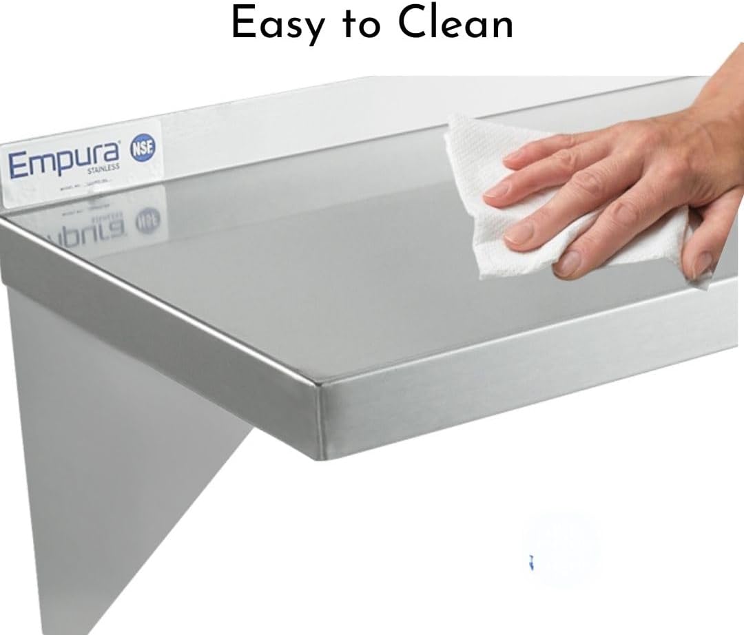 A hand wipes a stainless steel shelf with a white cloth. The smooth, clean wall mount storage shelf features an “Empura Stainless” label and NSF logo. Text at the top says “Easy to Clean.”.