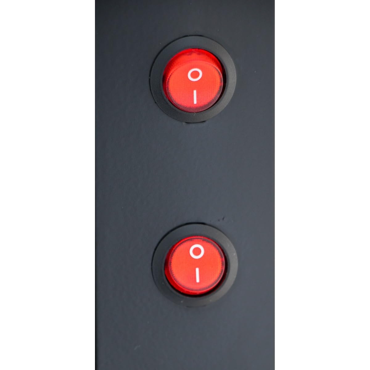 Close-up of two round red rocker switches on a dark gray panel of a commercial refrigeration unit, each with white I (on) and O (off) symbols. Both switches are oriented with I at the top and O at the bottom.