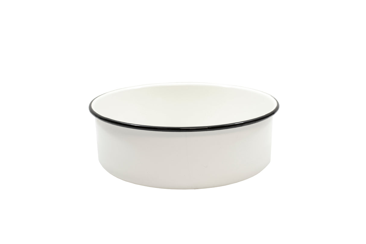 A plain, round, white ceramic bowl with a smooth surface and a thin black rim around the top edge sits on a white background. Reminiscent of classic enamelware serving tray designs, the bowl features a simple, minimalist style.