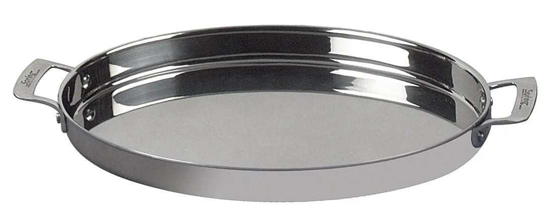 A shiny, oval stainless steel serving tray with two short, curved handles on opposite sides. The tray has a smooth, reflective surface and a shallow rim, perfect for presenting buffet sauté dishes. Set against a plain white background.