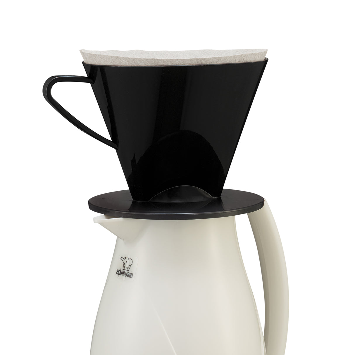 A black plastic coffee dripper with a white paper filter sits atop a white beverage server thermal carafe with a handle. The carafe, featuring a small polar bear logo, is designed for optimal heat retention and rests against a plain white background.