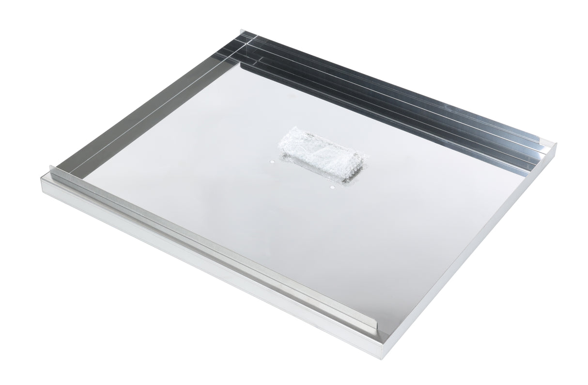 A shiny, rectangular Fryer Tank Cover with raised edges on three sides is pictured. At the center, a small, wrapped packet rests on the reflective surface. The scene is brightly lit with a white background, highlighting this Atosa USA accessory.