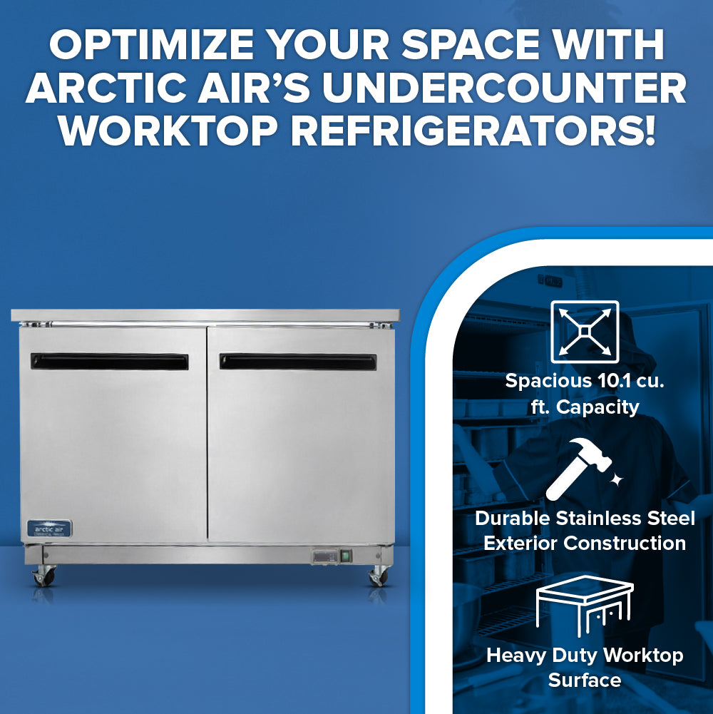 An Arctic Air AUC48R refrigerated work top counter is shown on a blue background. Text above and beside it highlights features: Spacious 10.1 cu. ft. Capacity, “Durable Stainless Steel Exterior Construction,” and “Heavy Duty Worktop Surface.”.