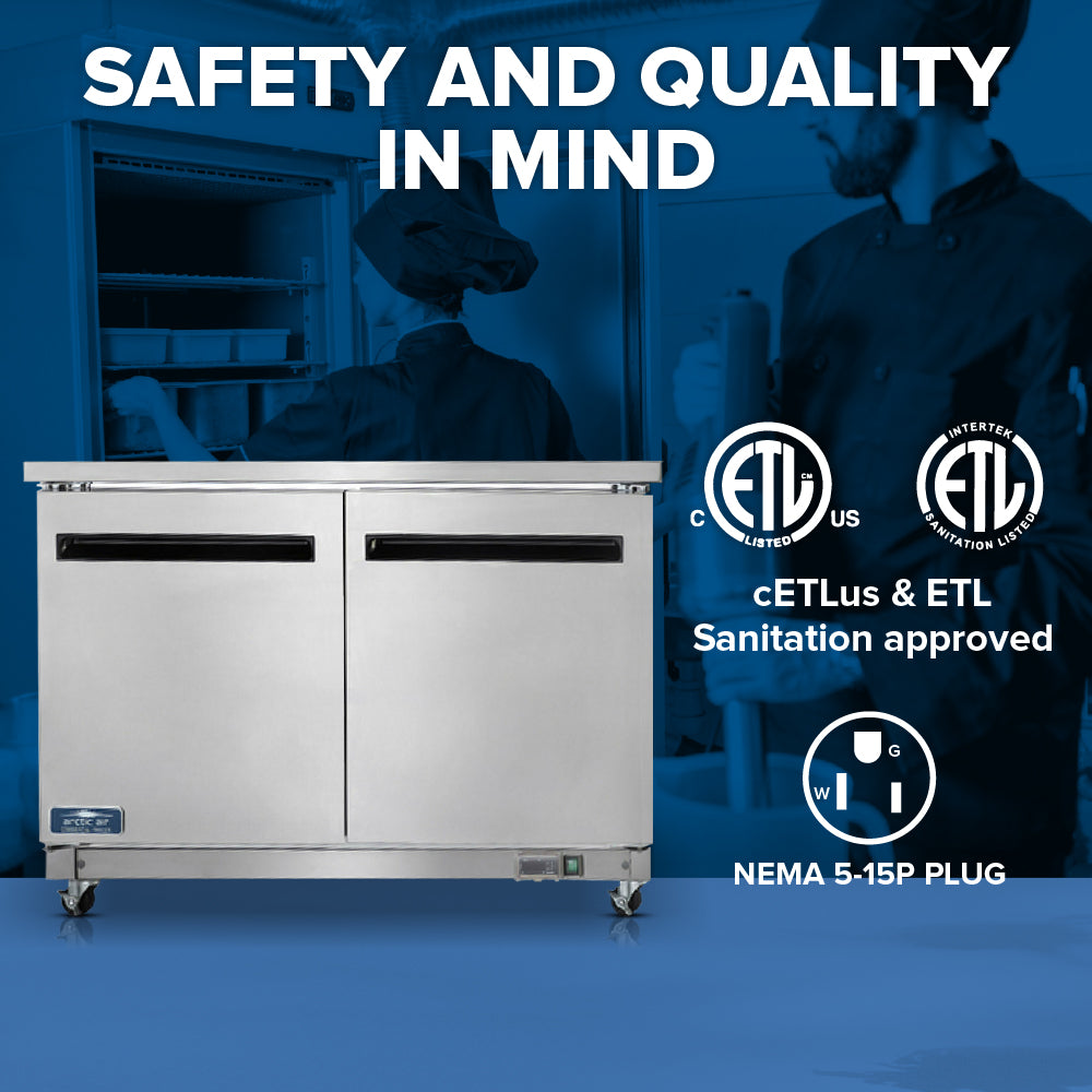 A stainless steel Arctic Air AUC48R reach-in refrigerator with two doors and casters is shown in the foreground. Behind it, two people in chef uniforms work in a kitchen. Certification logos highlight safety and quality.