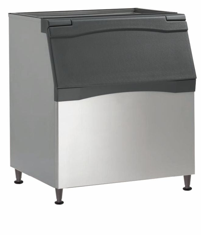 A commercial Ice Bin with a stainless steel body and black plastic flip-up lid, featuring polyurethane insulation for optimal cooling. The bin stands on four short legs, has a slightly angled front, and boasts a clean, industrial appearance.