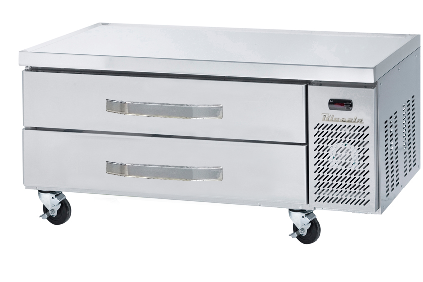 A stainless steel refrigerated chef base with two large drawers, side ventilation, a brand name plate, small display panel, and four caster wheels. The flat top offers extra equipment stand space, all in a sleek, industrial design.