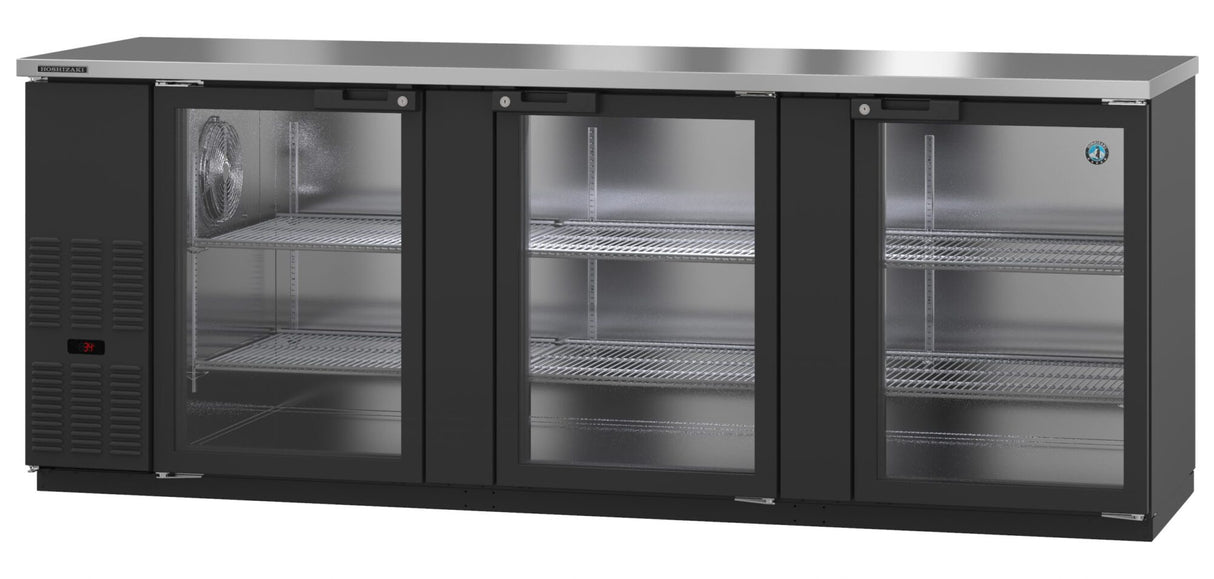 Three-section commercial bar refrigerator with a stainless steel top, three transparent doors, and multiple wire shelves inside each section. The left section features ventilation grills and a digital temperature display. This glass door cooler is clean and empty.