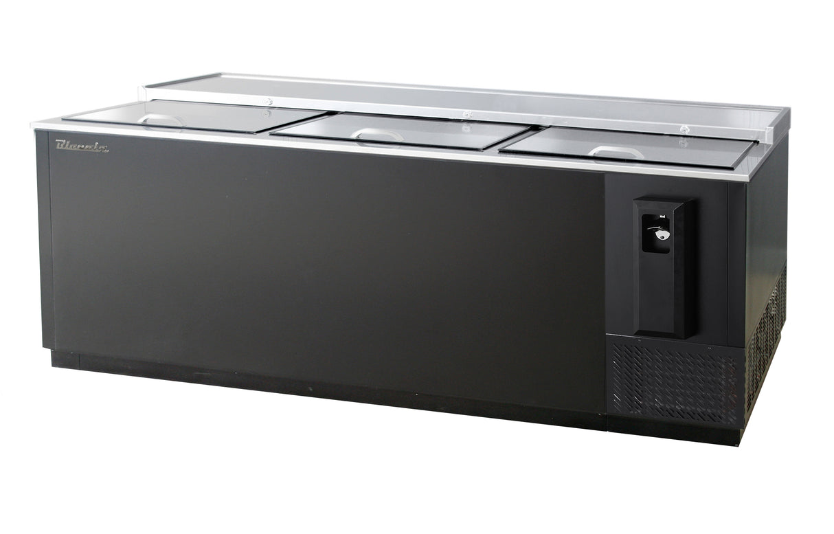 A large black commercial bottle cooler with a stainless steel top, three sliding glass doors, self-contained refrigeration, a built-in bottle opener and cap catcher on the front, plus ventilation grilles on the lower right side for efficient drink storage and display.