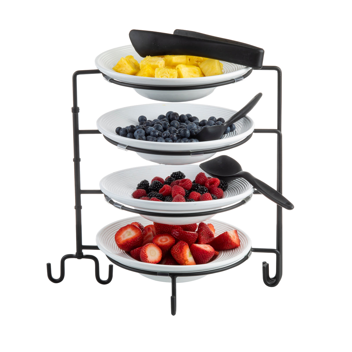 Four white plates on a black powder coated metal, four-tiered stand display fresh fruit: pineapple chunks, blueberries, blackberries with raspberries, and sliced strawberries. Slip resistant sleeves add stability to the elegant display.