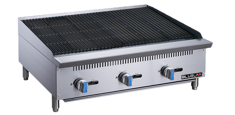 A stainless steel countertop gas charbroiler with three control knobs on the front, black grill grates on top, blue accents on the knobs, and the "Blueline" brand on the lower right corner. The unit features sturdy metal legs.